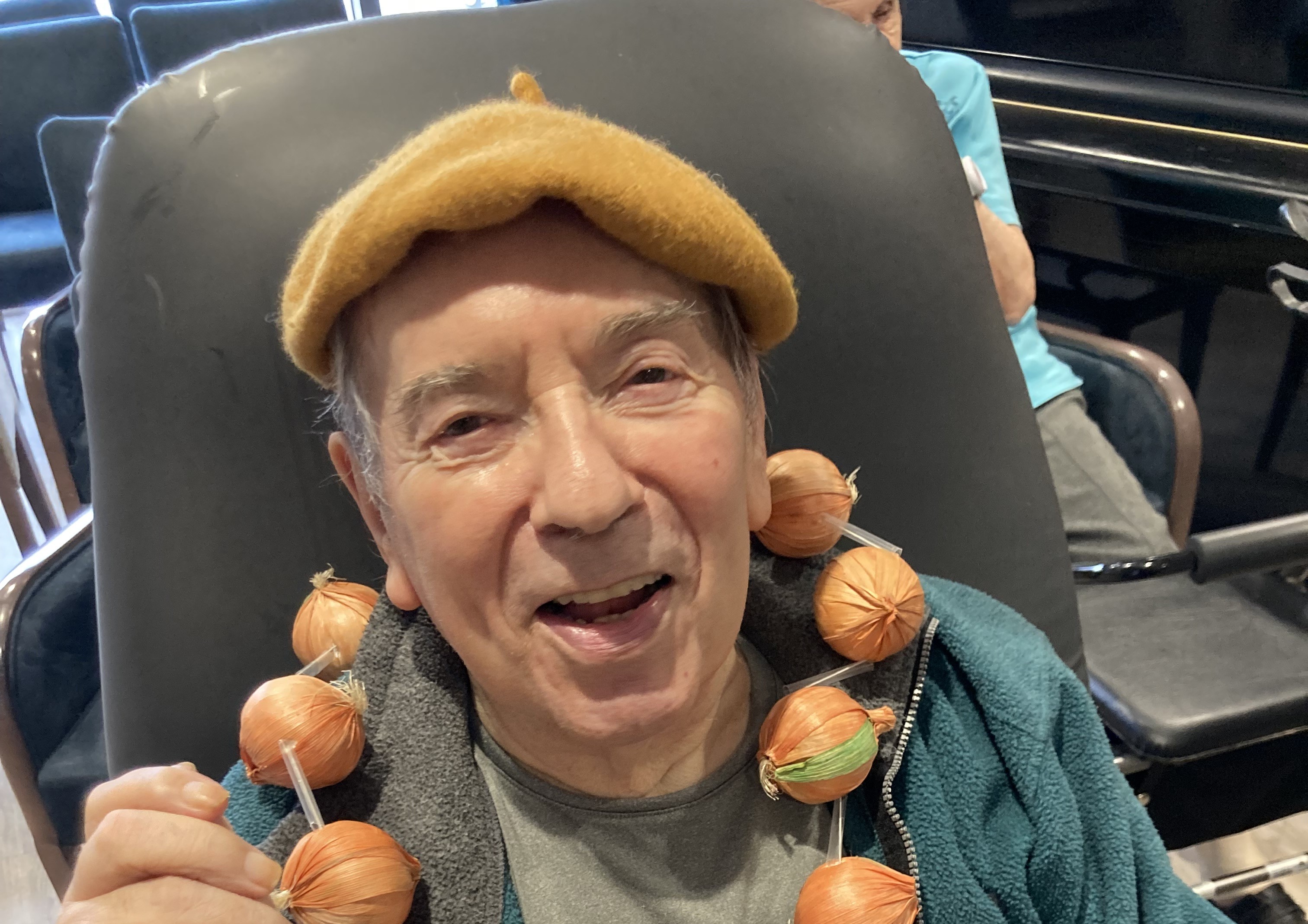 Asset - Pictured: Colin Moss, Belong Morris Feinmann resident, gets into French swing of things for the language session 
