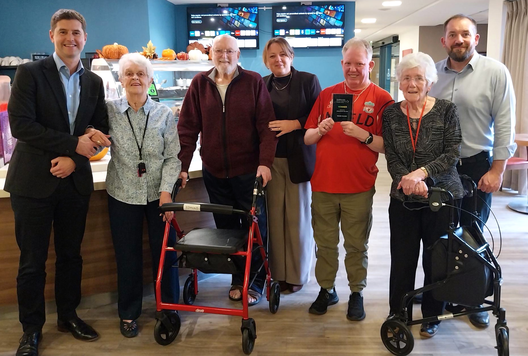 (L-R) Martin Rix, Belong CEO; Joan and Edmund; Rebecca Woodcock, Belong COO; Mark, Joan, and Barry Devine, General Manager