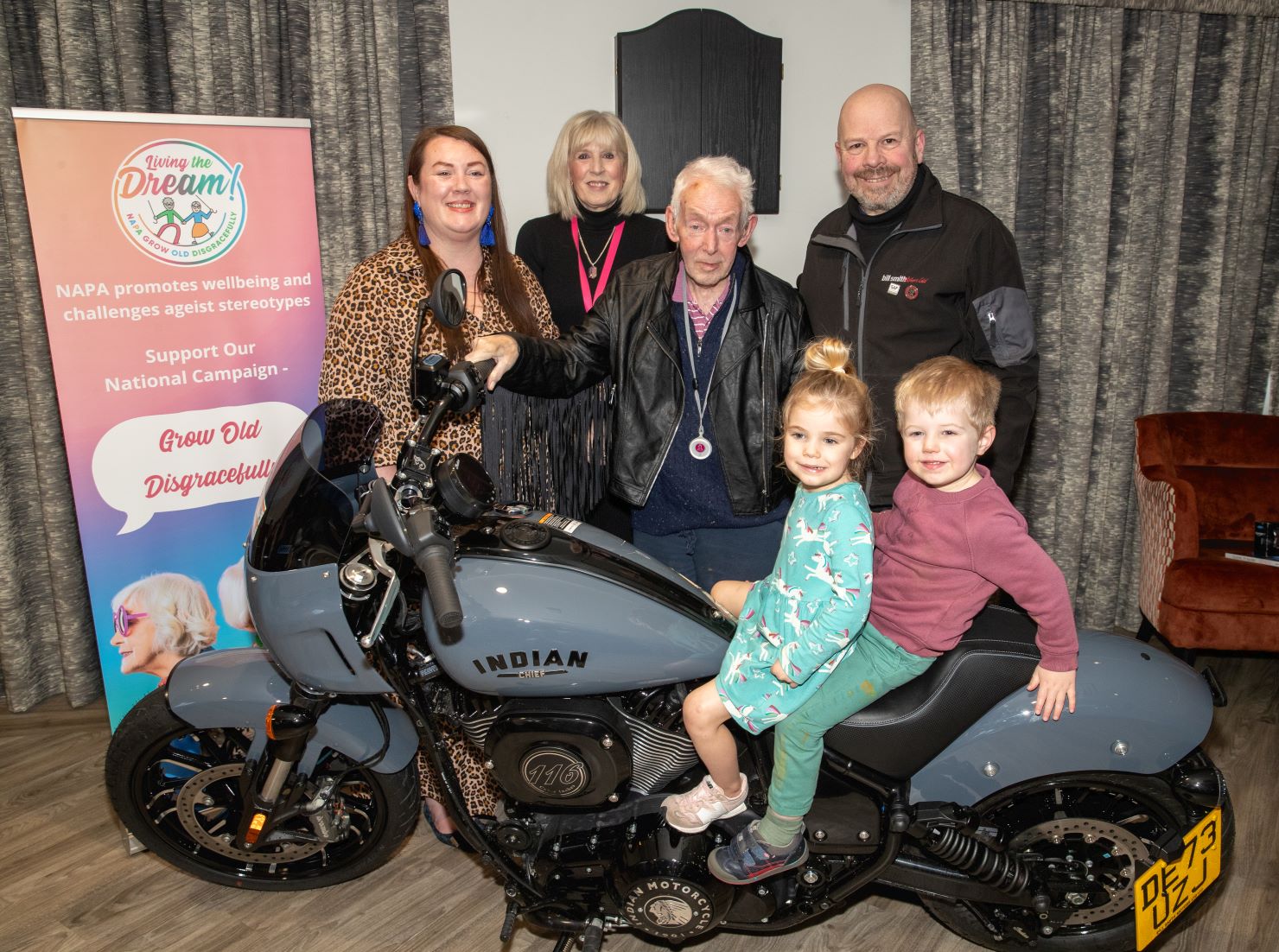 Bill and the children with the Indian superbike (LtoR): NAPA service development officer Natalie Ravenscroft, Sue Egersdorf, Bill Ward and David Davies, with nursery children Emmie Hannigan and Joshua Dodd.
