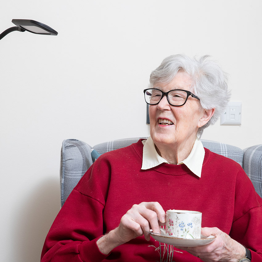 Apartment resident enjoying a cup of tea