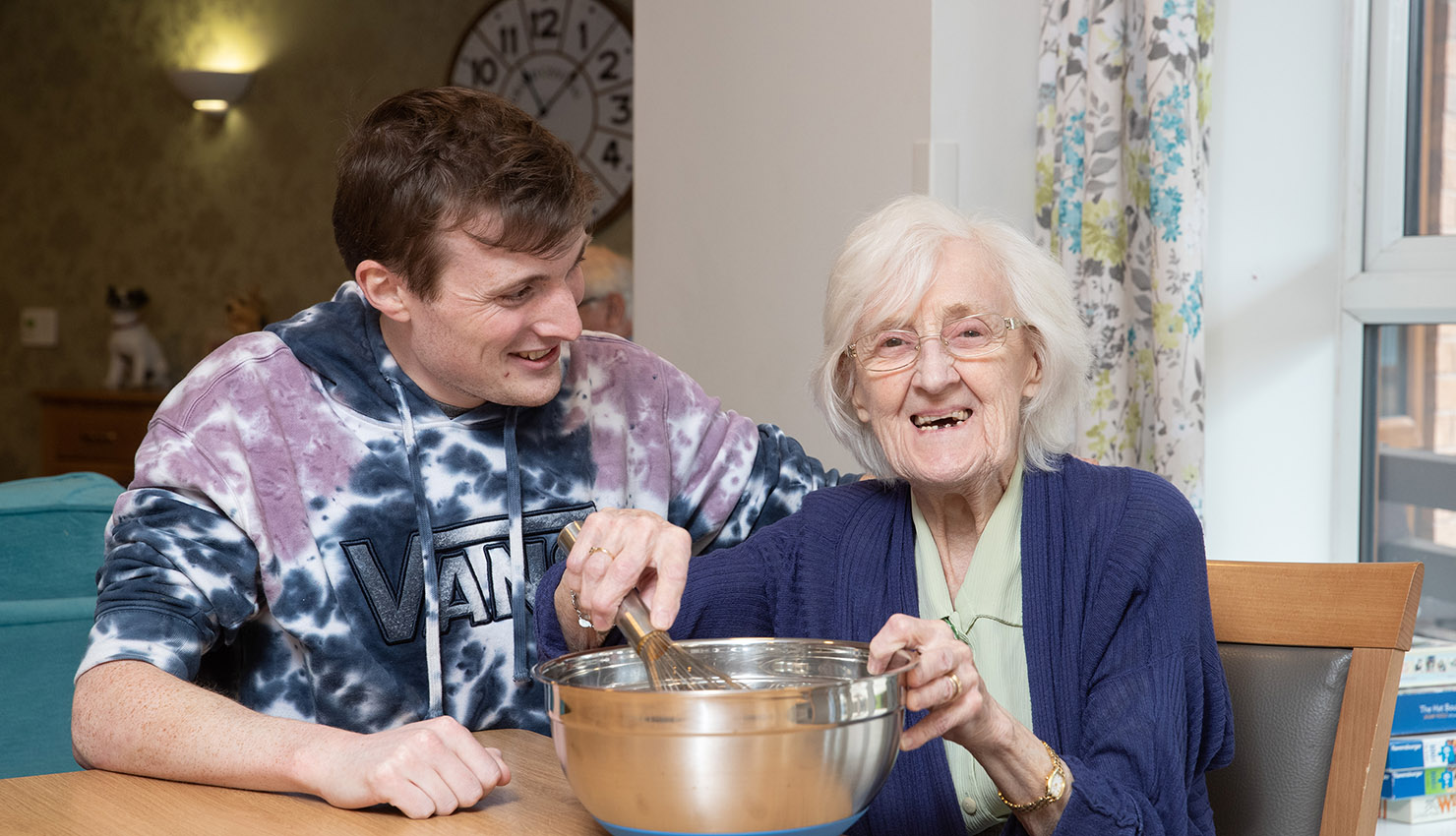 Belong Macclesfield Carer and resident cooking on household