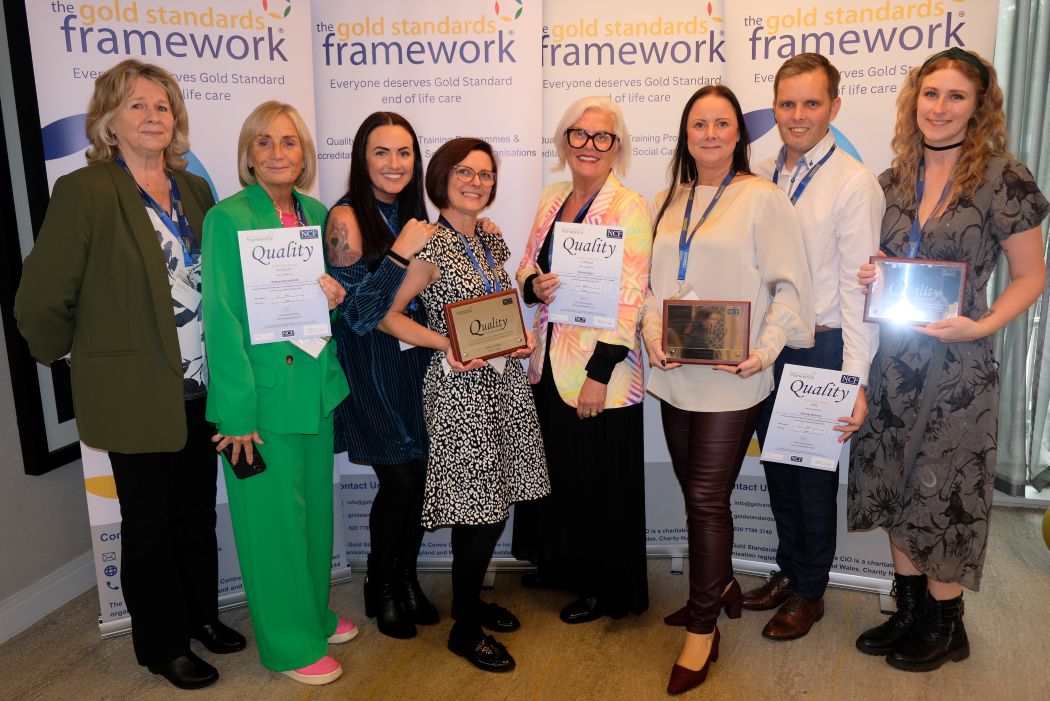 Belong accepts its Quality Hallmark Award reaccreditations for its end-of-life care provision. 