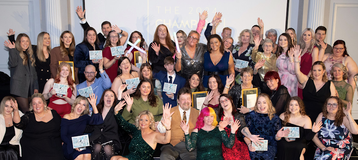Pictured: Belong colleagues celebrate their success at the annual Champion Awards