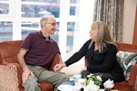 Belong Chester - Admiral Nurse and resident having a cup of tea
