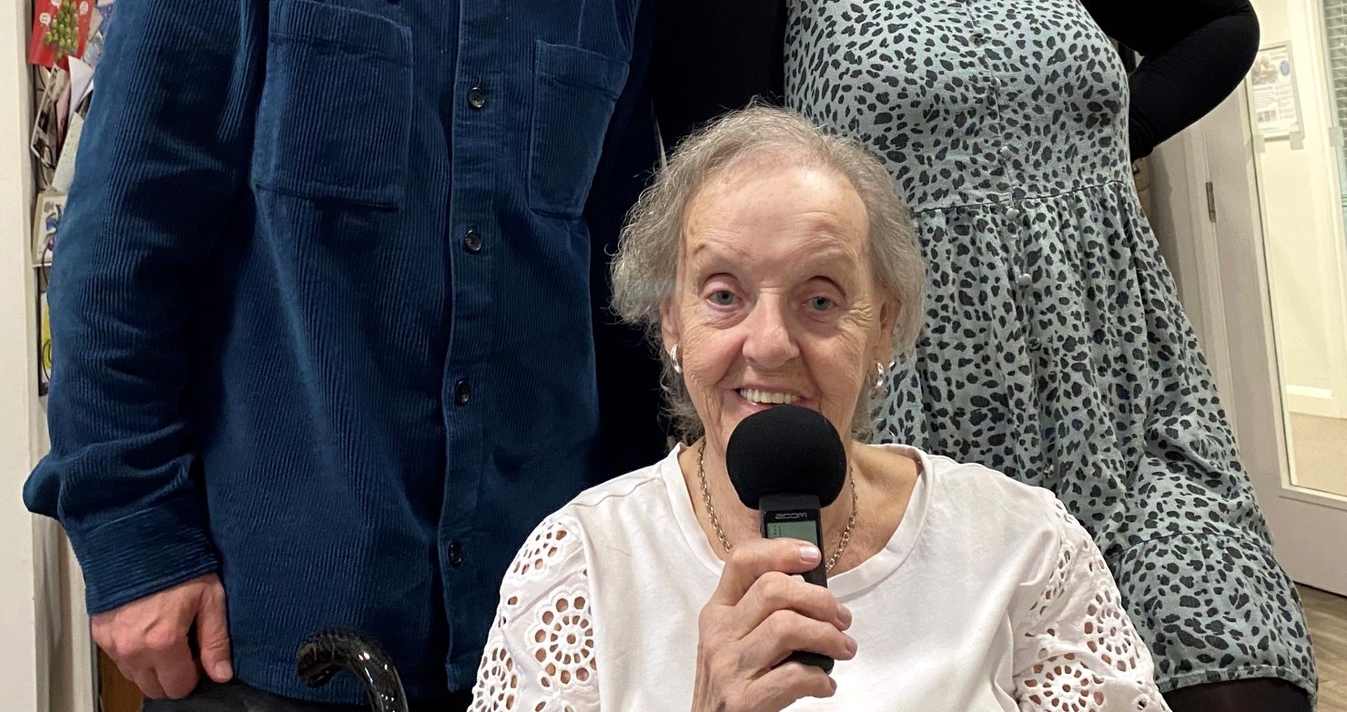 Pictured: Diane Wrench (seated), with Radio Warrington's Andy Green and Belong Warrington experience coordinator, Louise Kelly. 