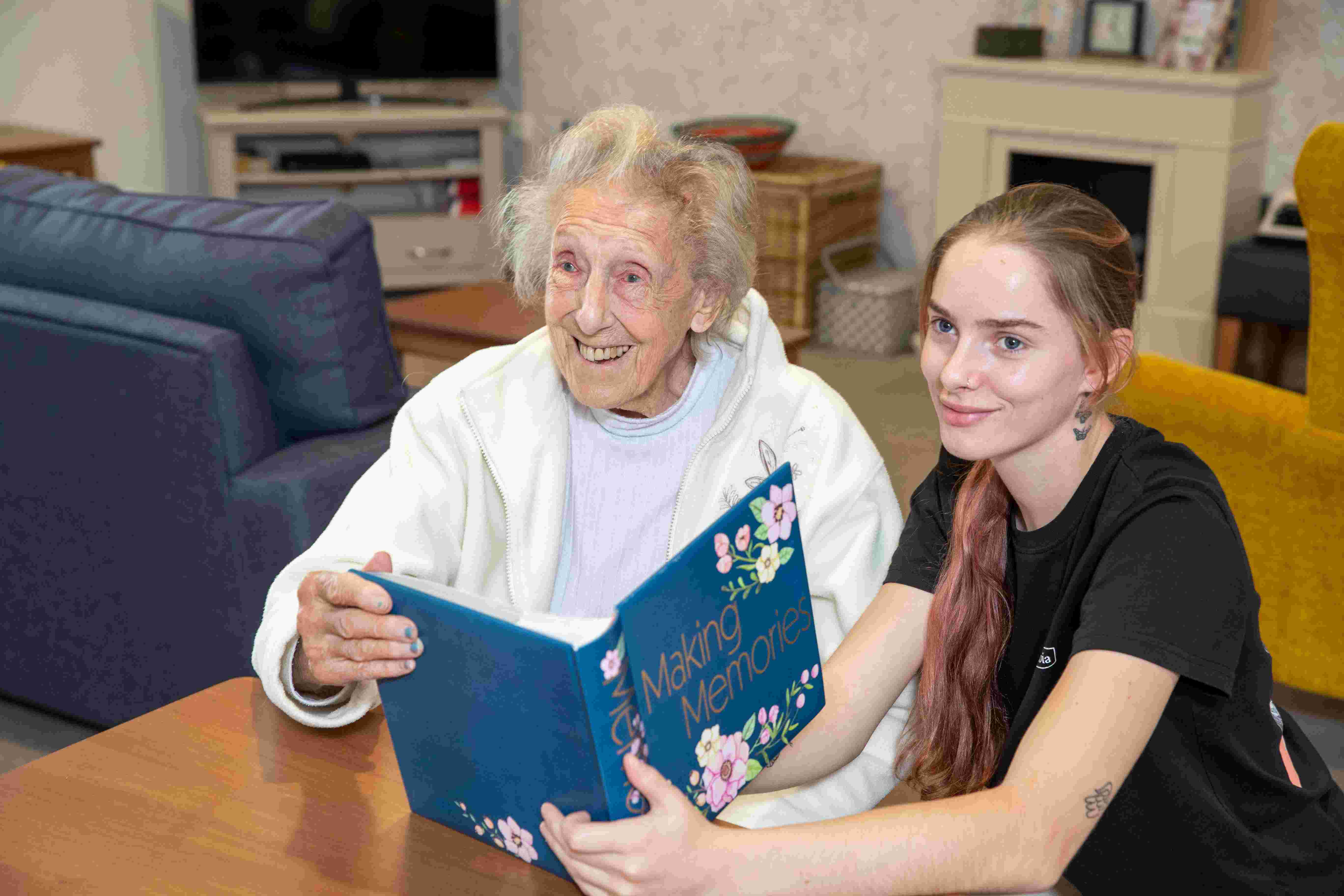 Asset - Belong Chester - Carer and lady reading a book
